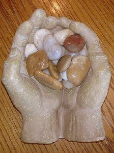 Sculpture Hands Holding Stones